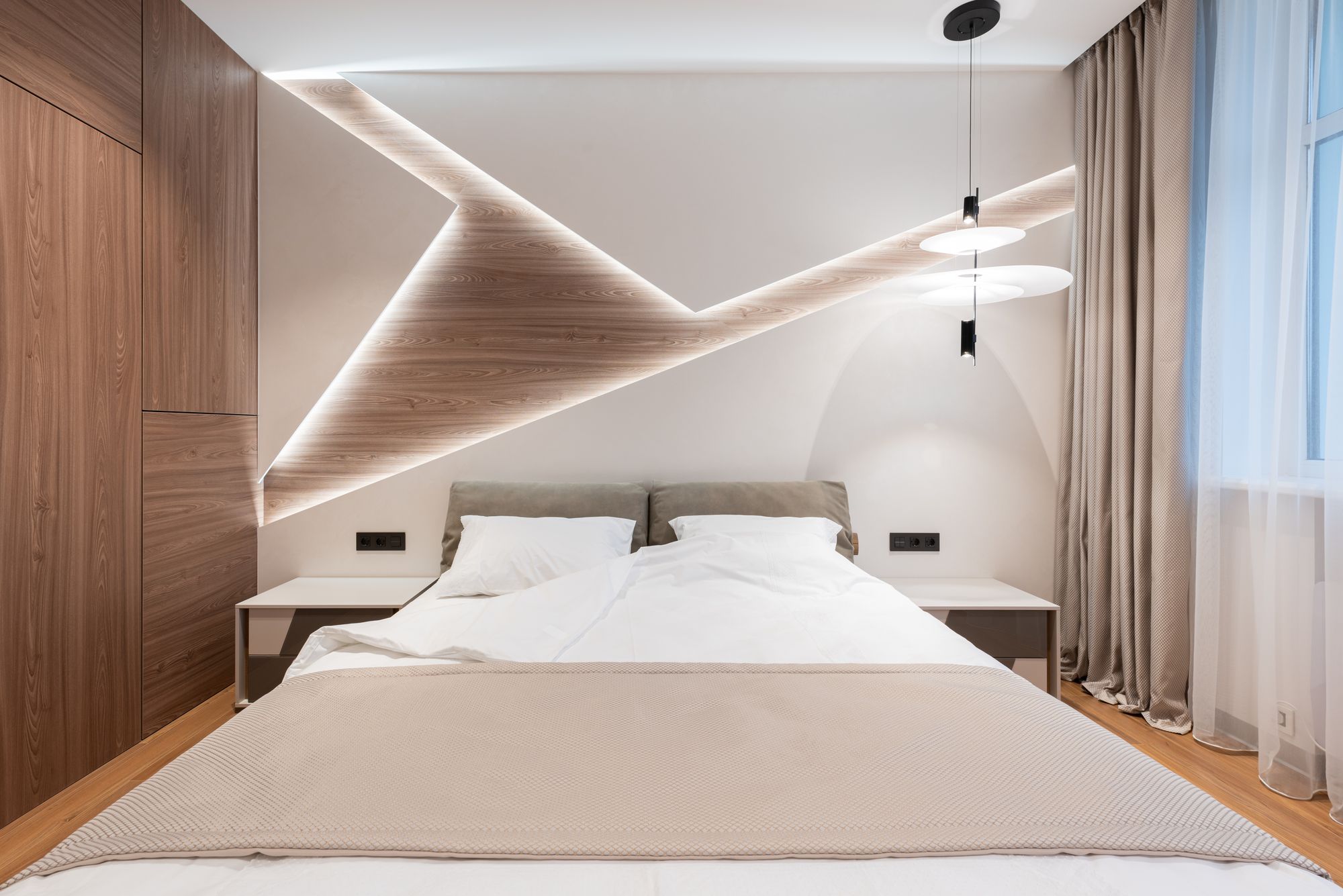 Bright room with white textiles and natural wood